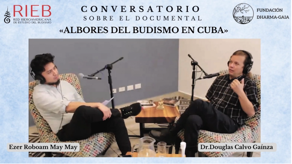 Two men sitting in chairs with microphonesAI-generated content may be incorrect.