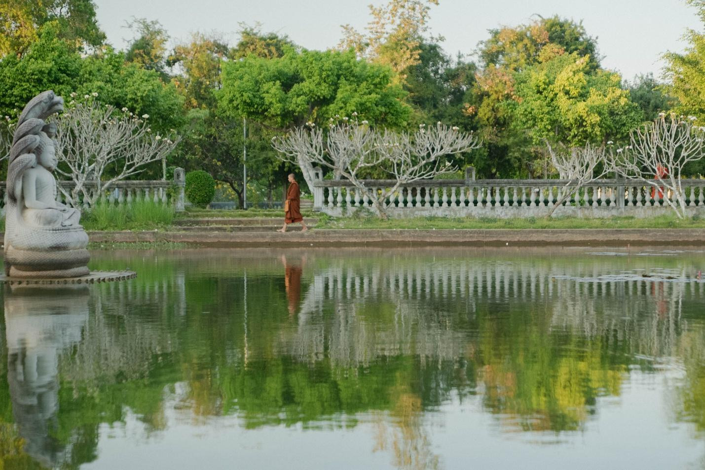 A person walking near a body of waterAI-generated content may be incorrect.