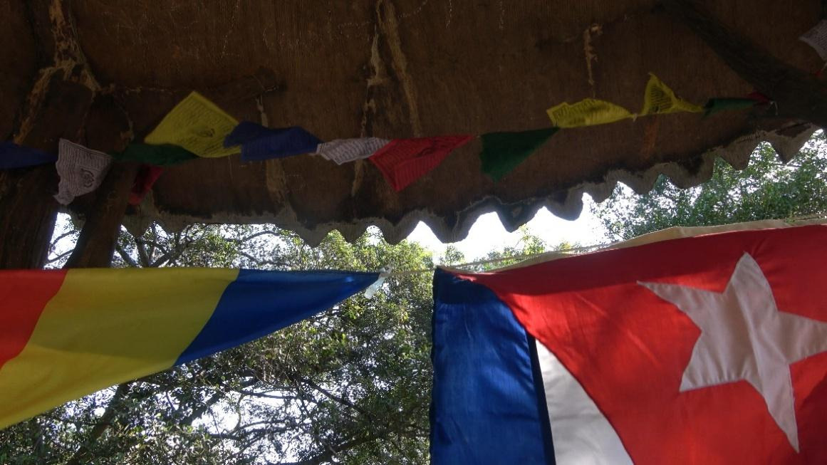 A group of flags from a roofAI-generated content may be incorrect.