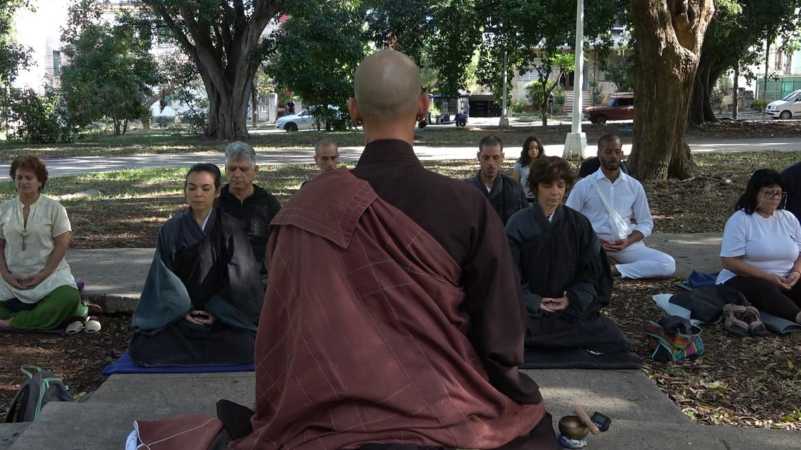 A group of people sitting on the groundAI-generated content may be incorrect.