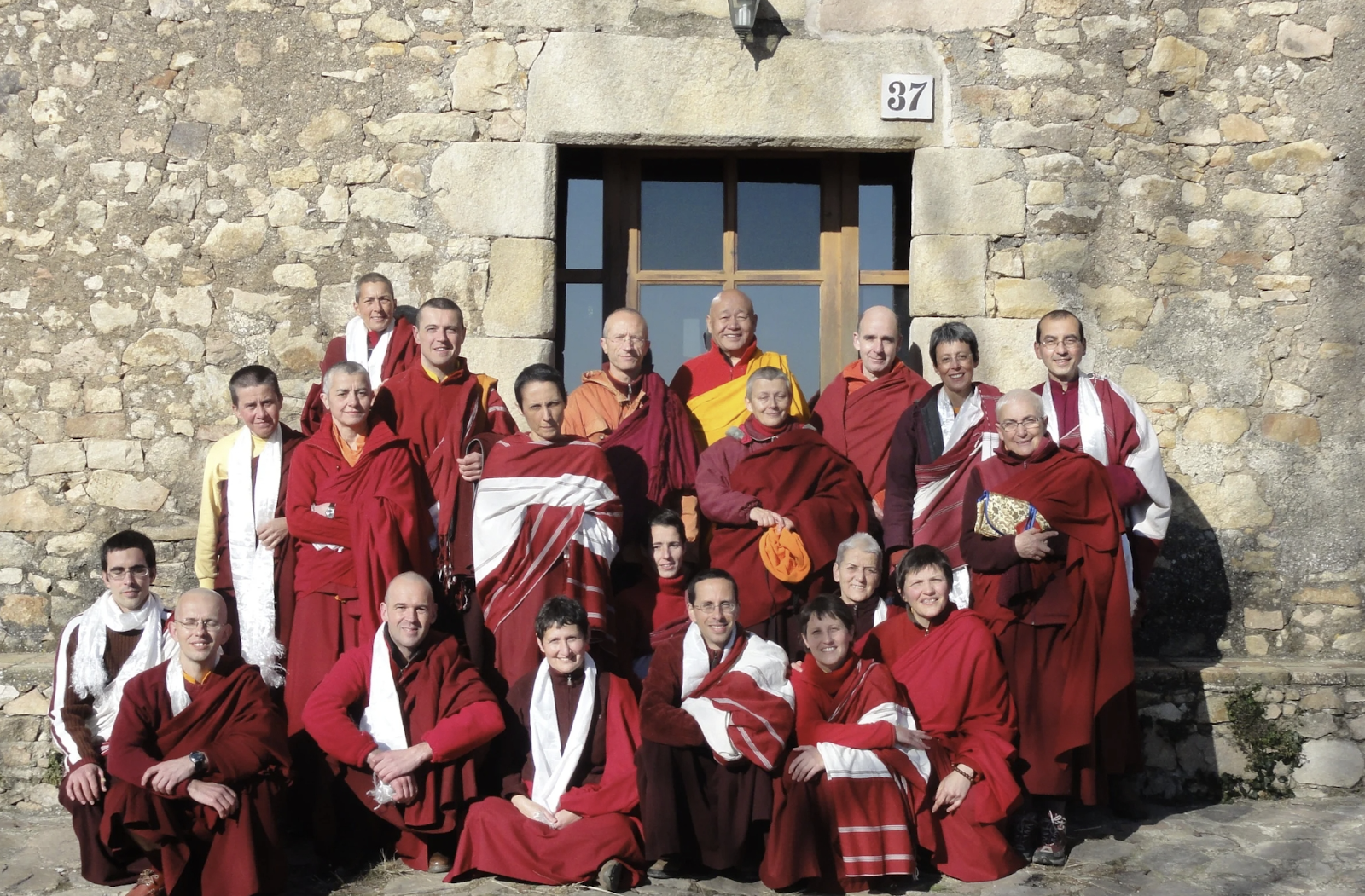 A group of people wearing red robesAI-generated content may be incorrect.