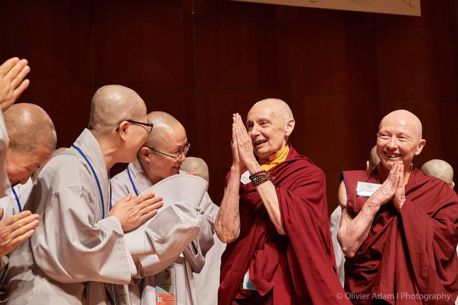 A group of people standing togetherAI-generated content may be incorrect.