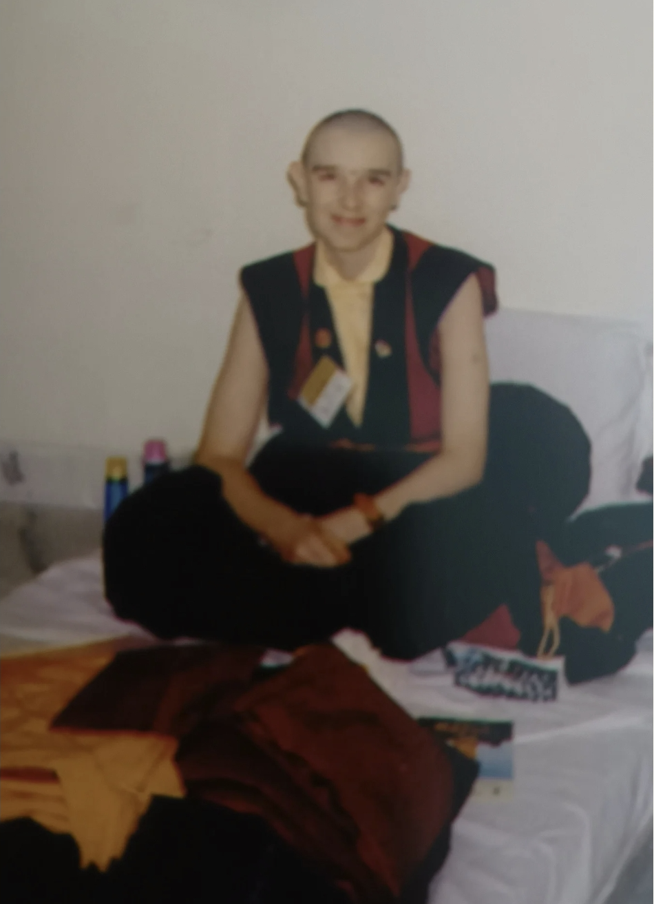 A person sitting on a bed