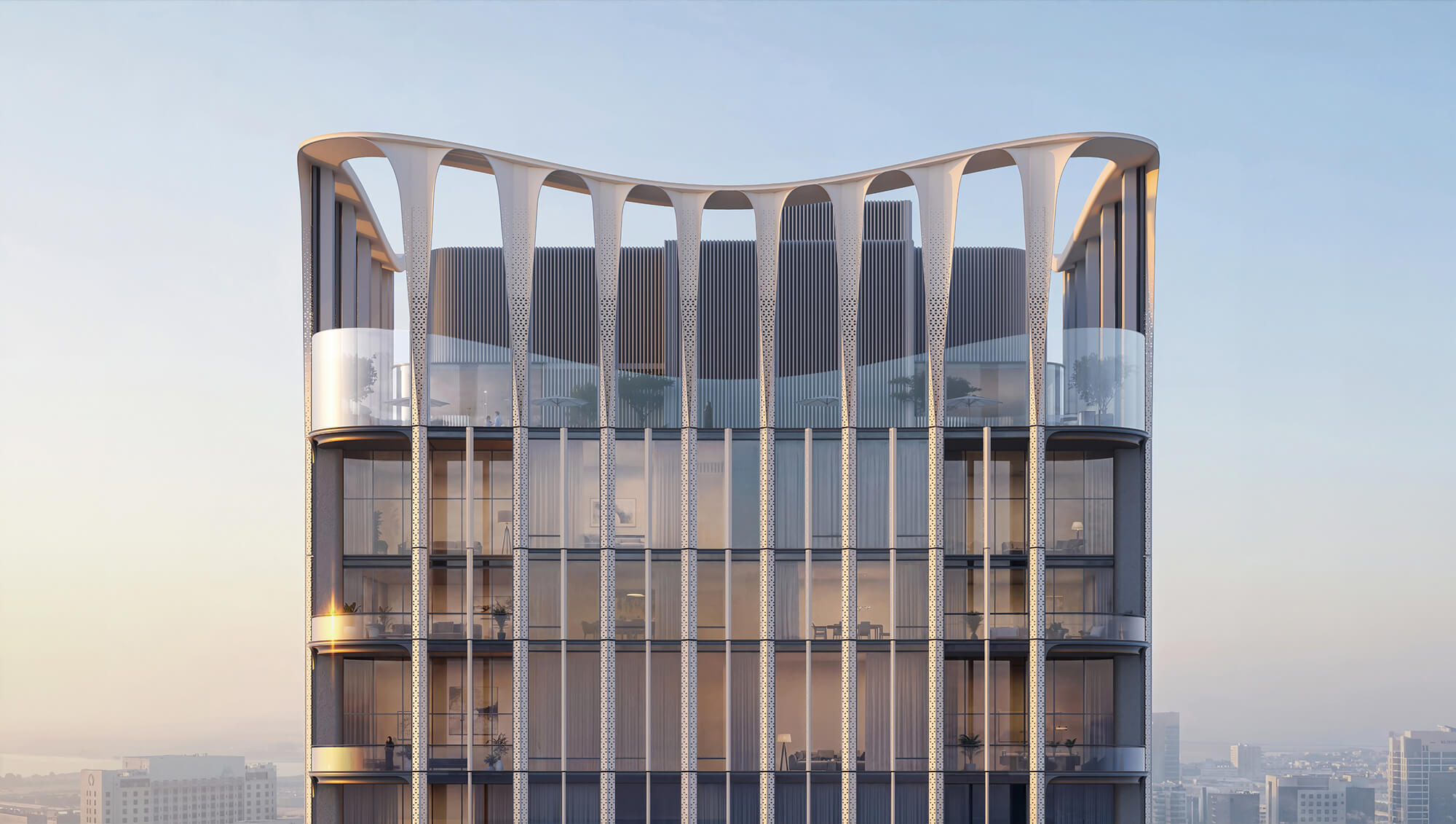 Modern architectural tower with curved top, glass facade, and ornate metallic columns overlooking cityscape