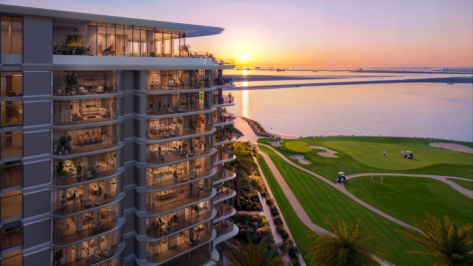 Modern waterfront residential building overlooking golf course and bay at sunset.