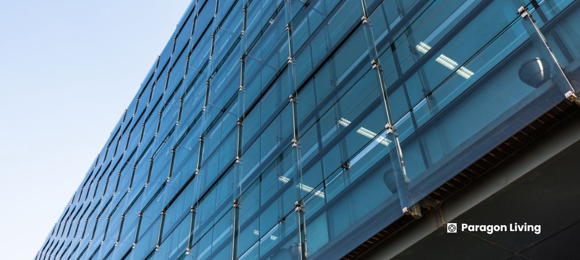 Close-up of a modern building with glass walls, part of the New Economic Growth Zone creating thousands of jobs.