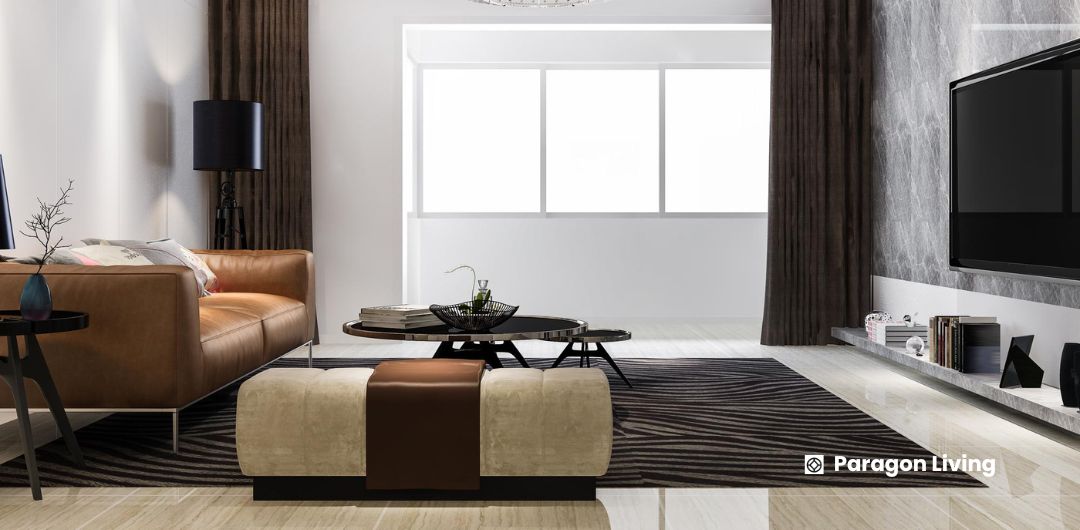 A welcoming living room highlighting a big TV and sophisticated leather furniture, created for relaxation and socializing.