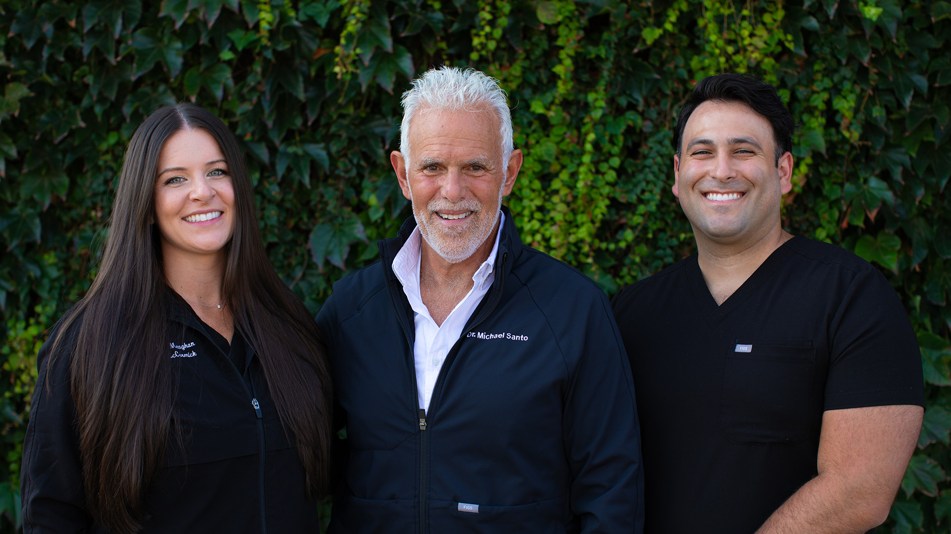 Dr. Meaghan P. McCormick, D.M.D., Dr. Michael J. Santo, D.D.S., and Dr. Marcus Santo, D.M.D. standing next to each other