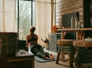 A woman doing yoga in her cabin