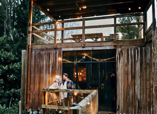 A couple on a romantic weekend at Christmas in a cabin in the woods in the Ardennes