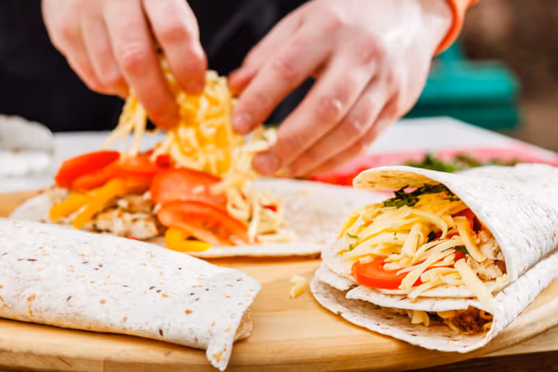 Chef fills quesadillas before toasting