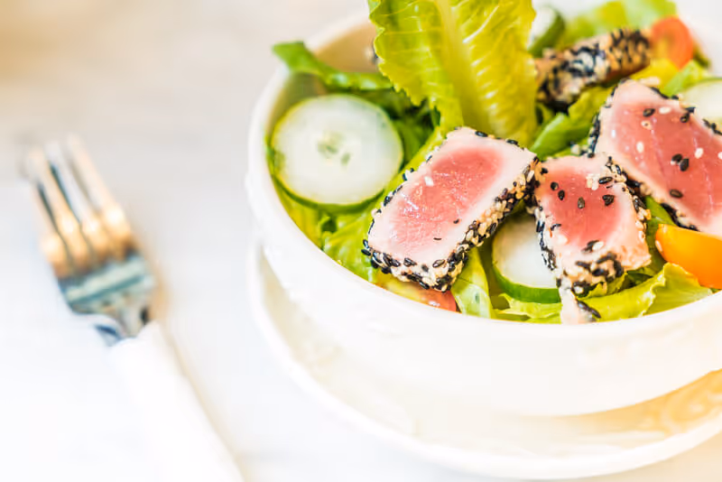 Seared tuna top a crisp, green salad