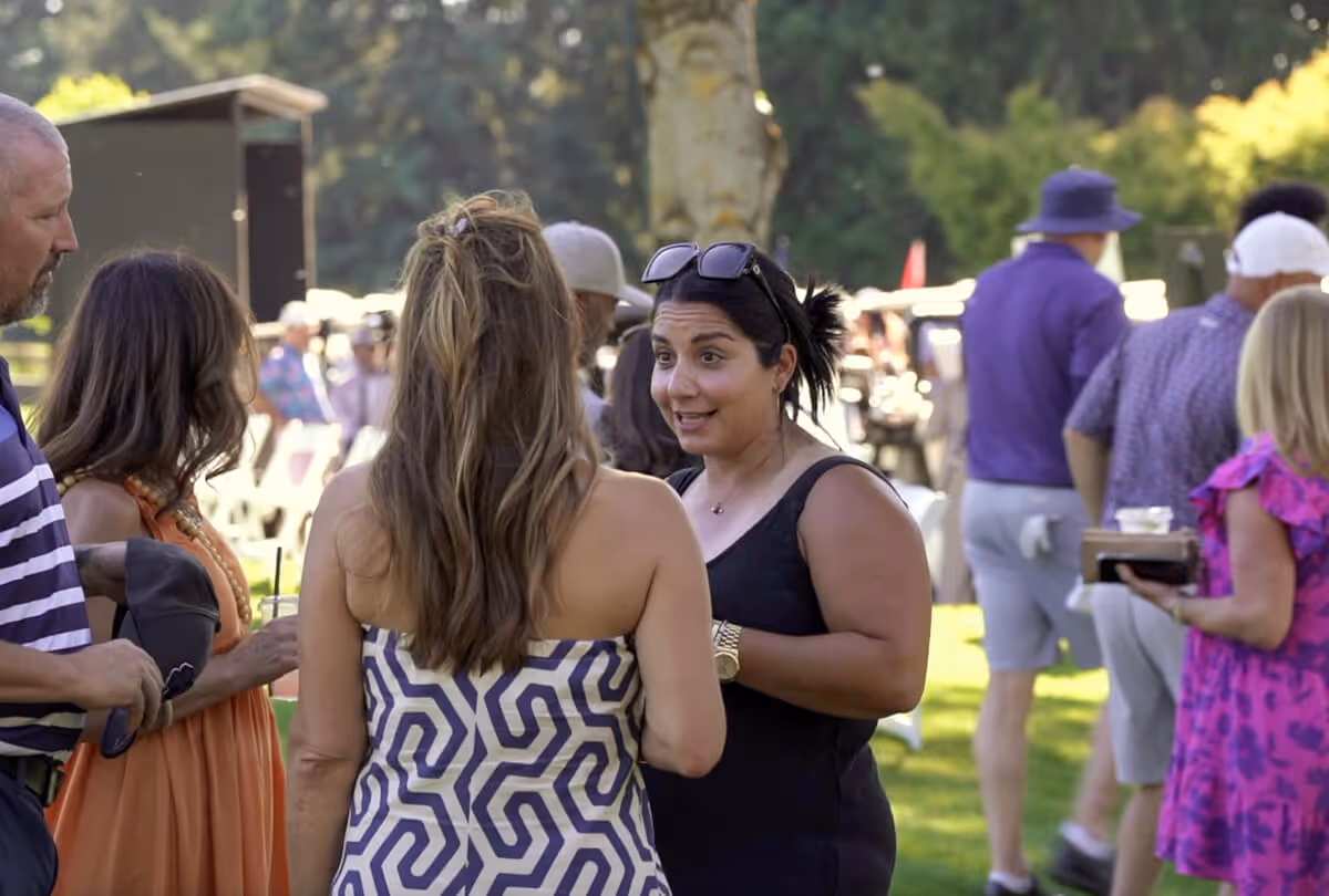 Three women chatting during a WOC event at Columbia Edgewater