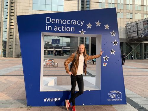 School of Gaming's CEO Mikko in front of European Union Democracy in Action installation in Brussels