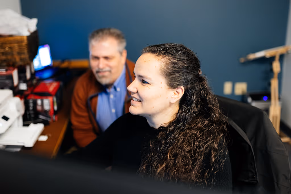 Stratus team members work to set up a computer network.