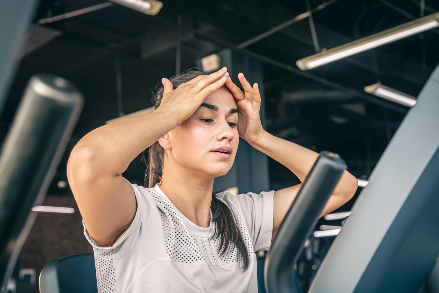 Woman fatigued after overtraining during a training session