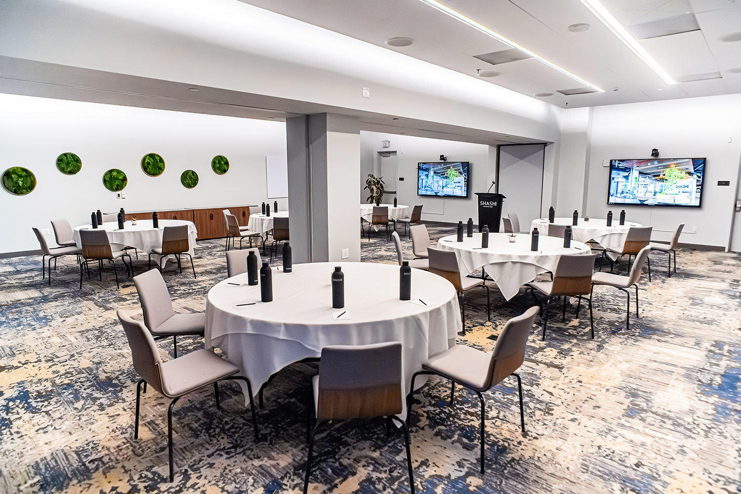 Napa and Sonoma meeting rooms combined at Shashi Hotel Mountain View with round table setup for corporate events and private dining in Silicon Valley.