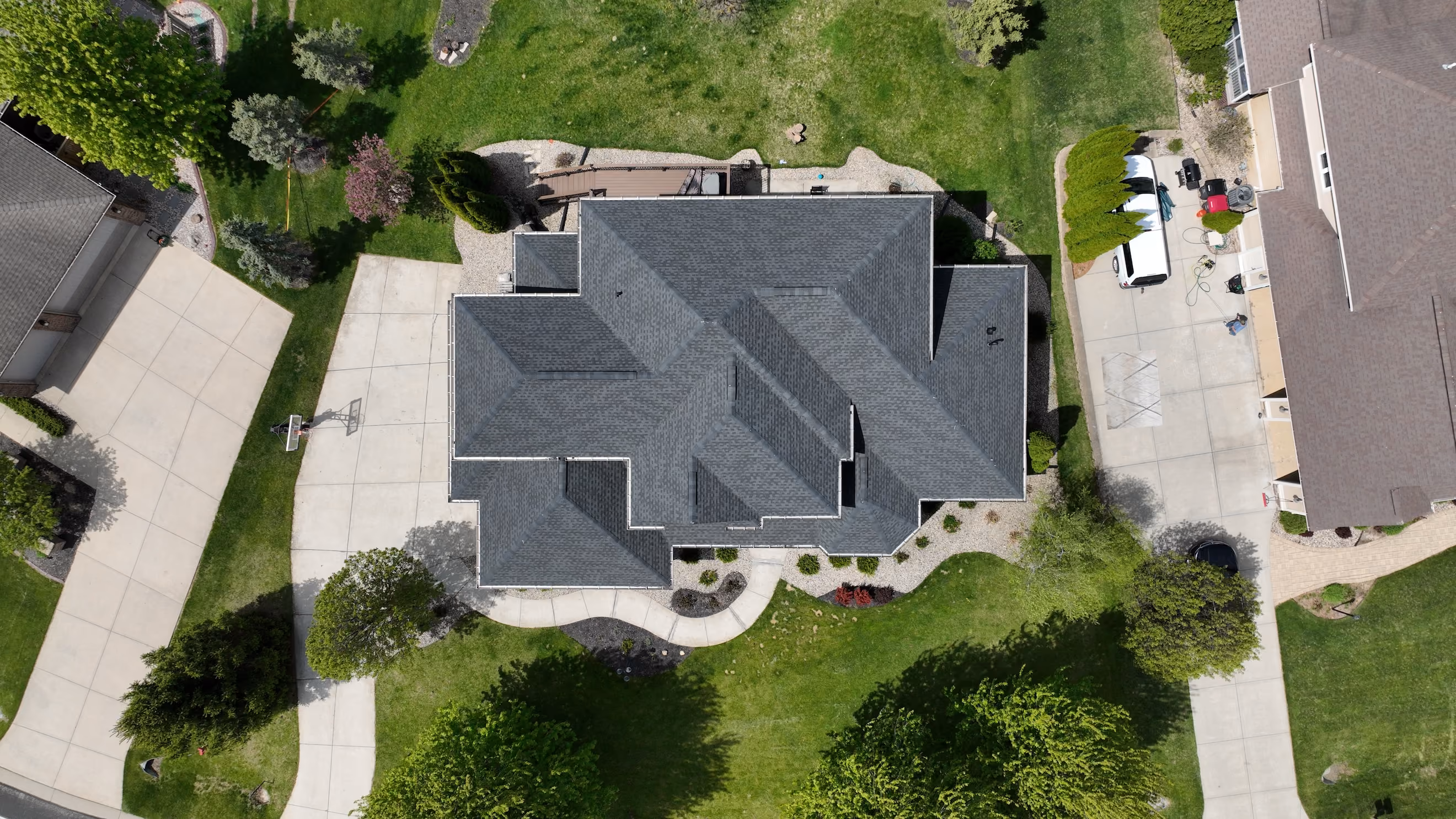 Aerial view of a home with a new gray architectural asphalt shingle roof