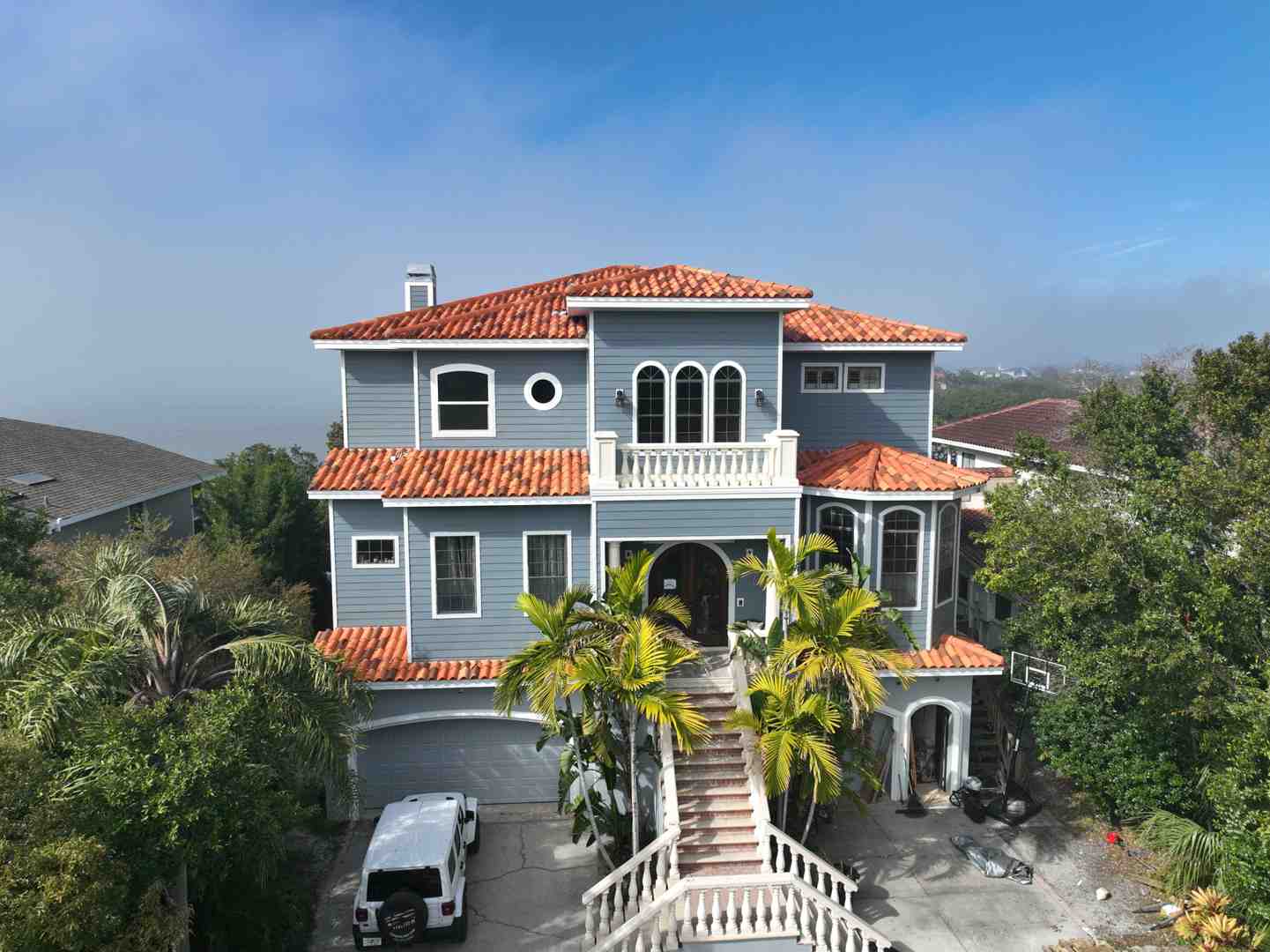 classic home with heavy slate or clay tile roof - durable roofing materials