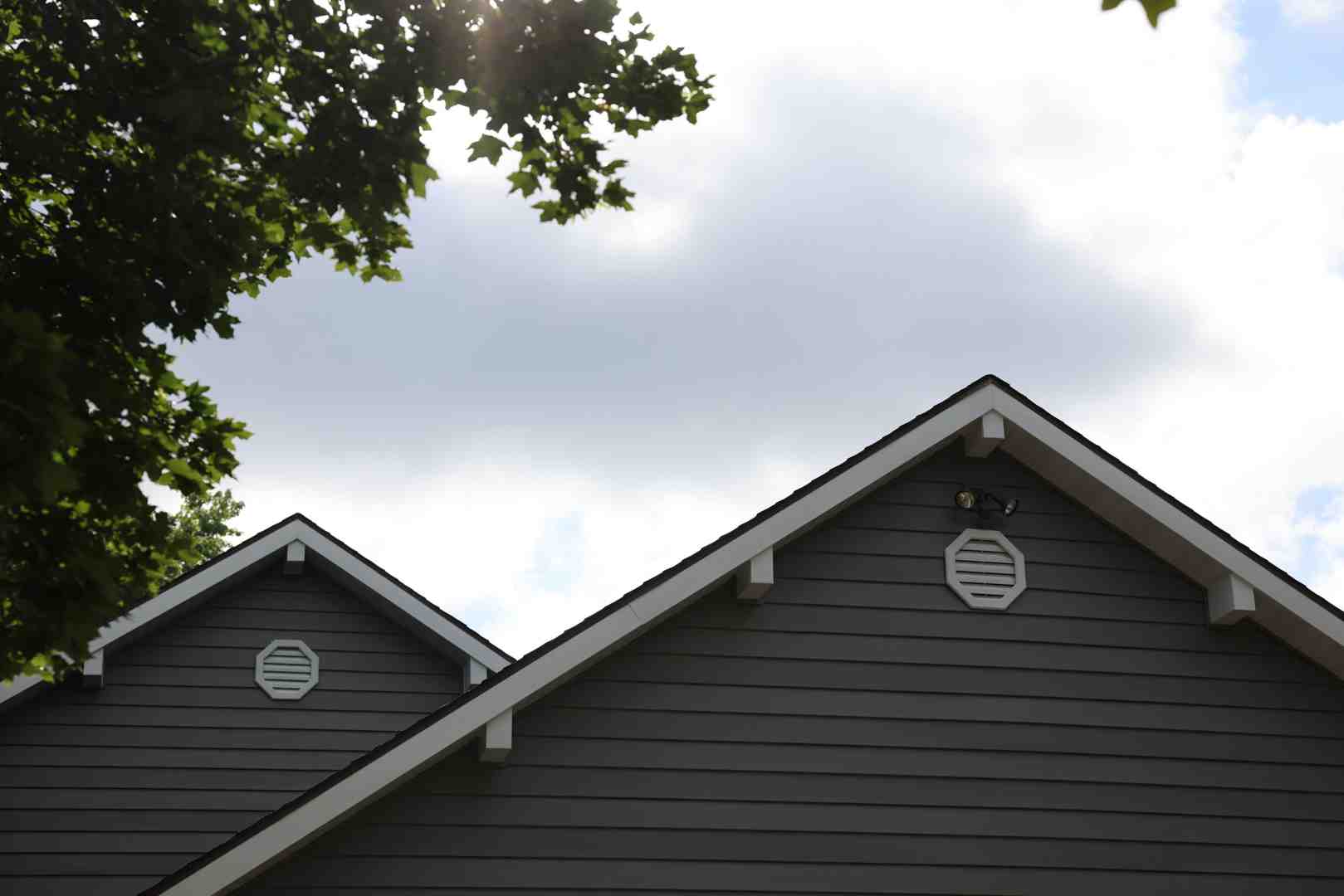 beautiful GAF architectural shingle roof in a color like Charcoal or Pewter Gray - durable roofing materials