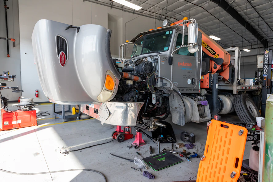 Diesel mechanic performing heavy equipment repair in San Antonio, Texas