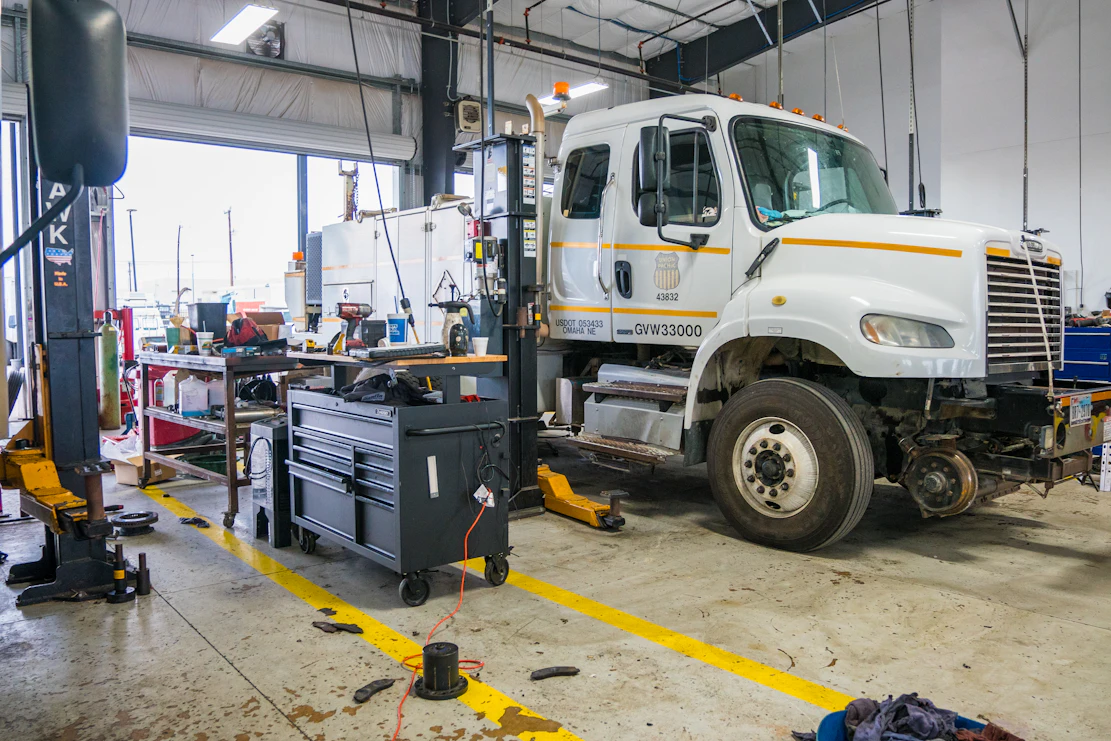 Diesel mechanic performing general repairs on semi truck in San Antonio, Texas