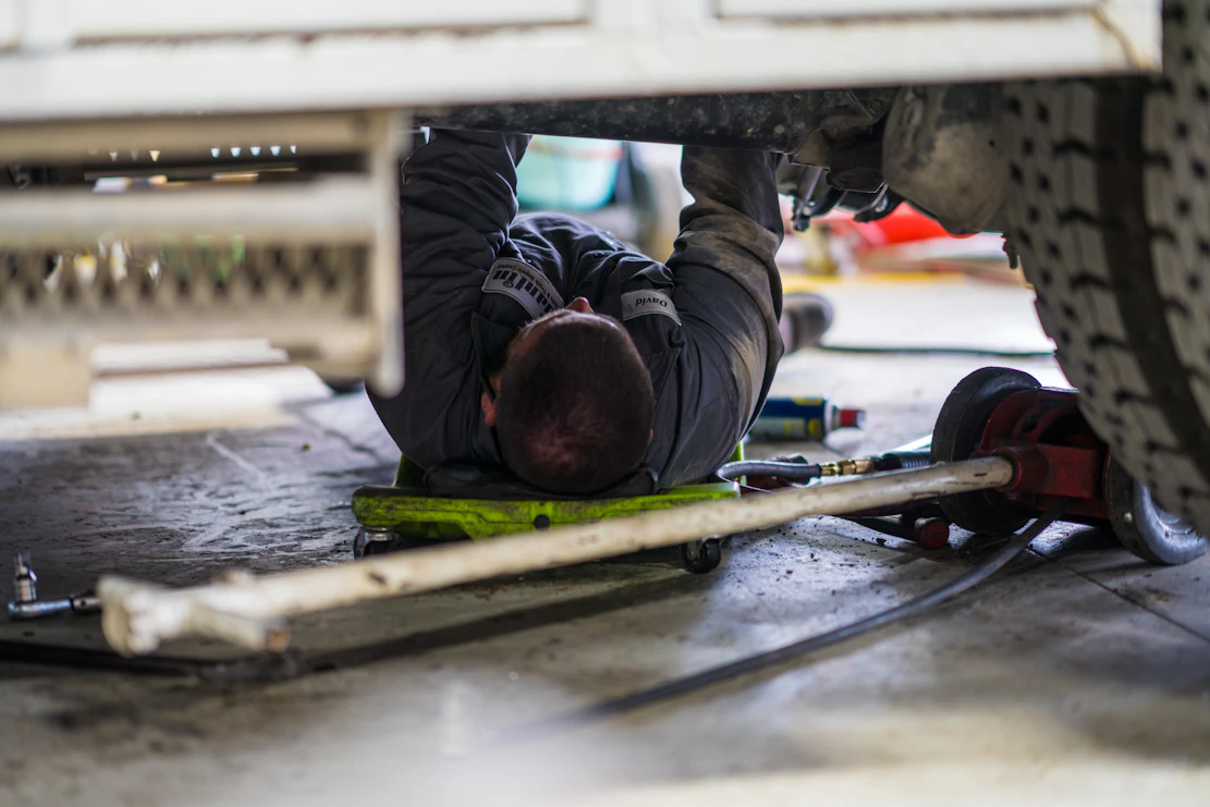 Diesel mechanic performing DOT Inspection on semi truck in San Antonio, Texas