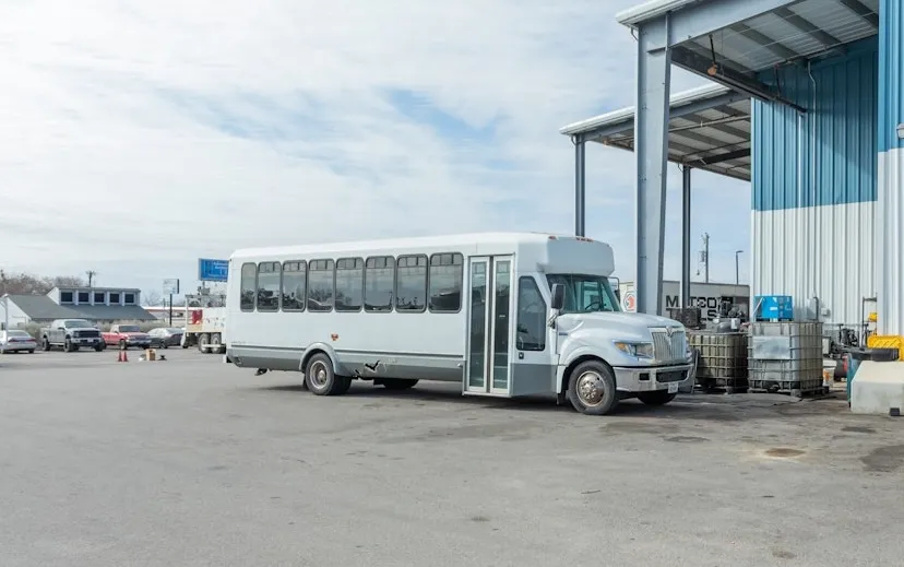 Diesel mechanic performing bus repair services on semi truck in San Antonio, Texas