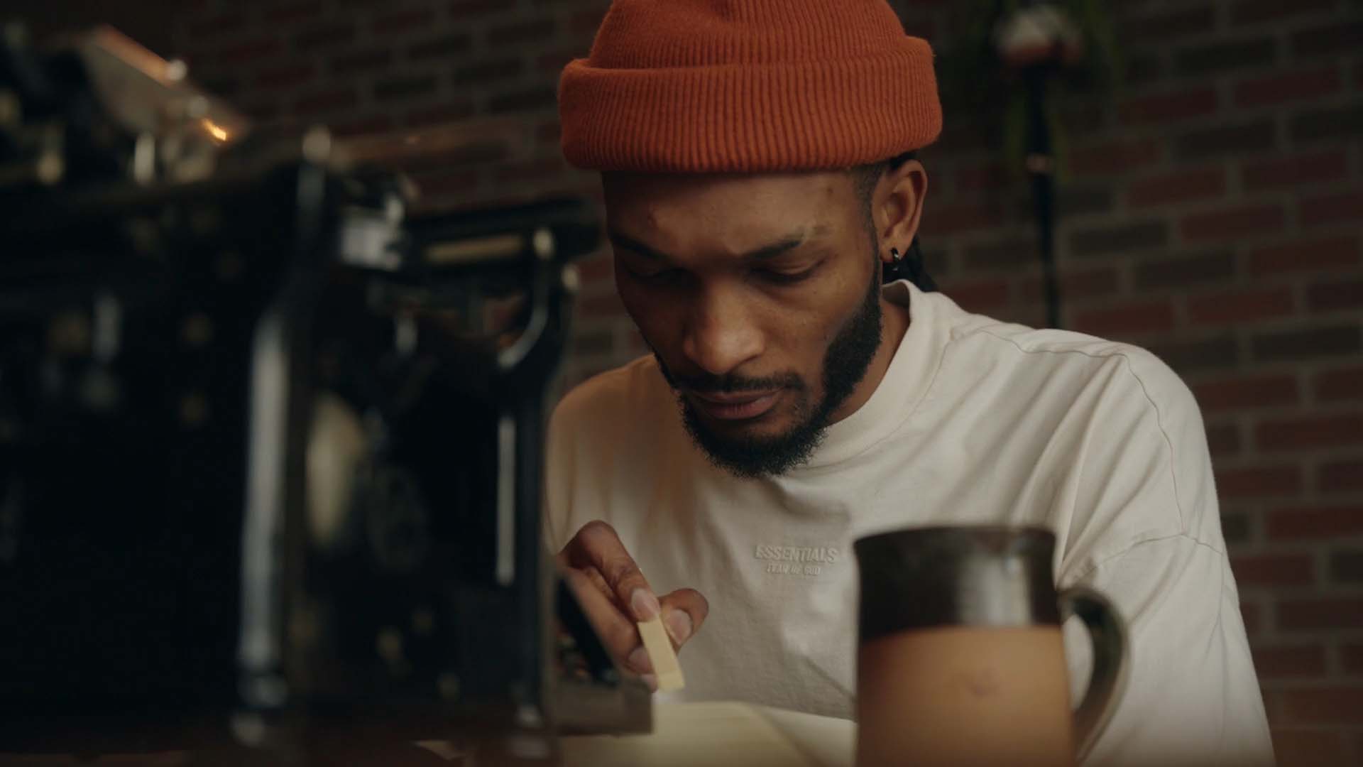 A man typing on a typewriter