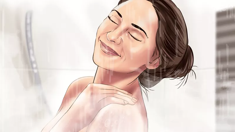 a colour frame of a woman enjoying a shower