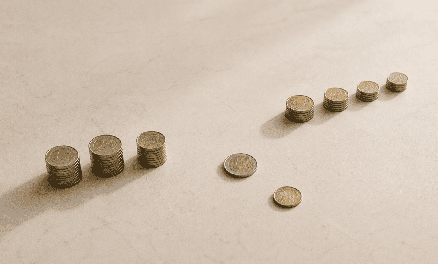Stacks of Euro coins and two single coins arranged on a beige surface with shadows.