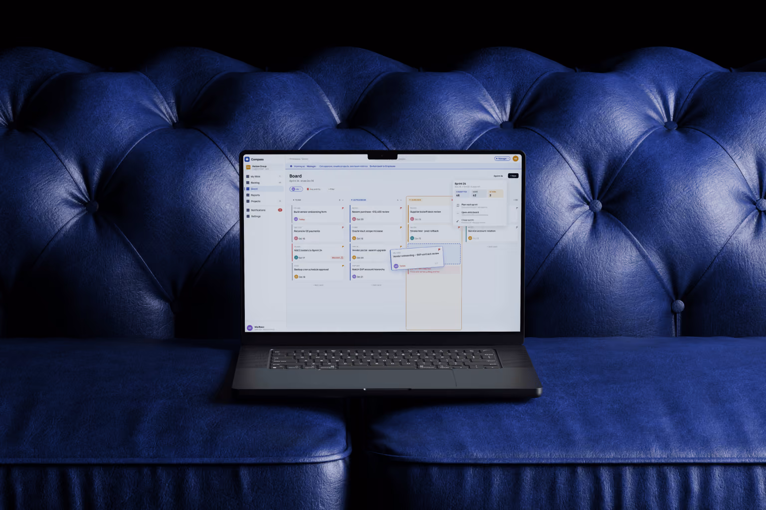 Compass task management workspace shown on a laptop — My Work screen with role-based task list, filters and sprint overview designed to replace Jira at Halden Group.