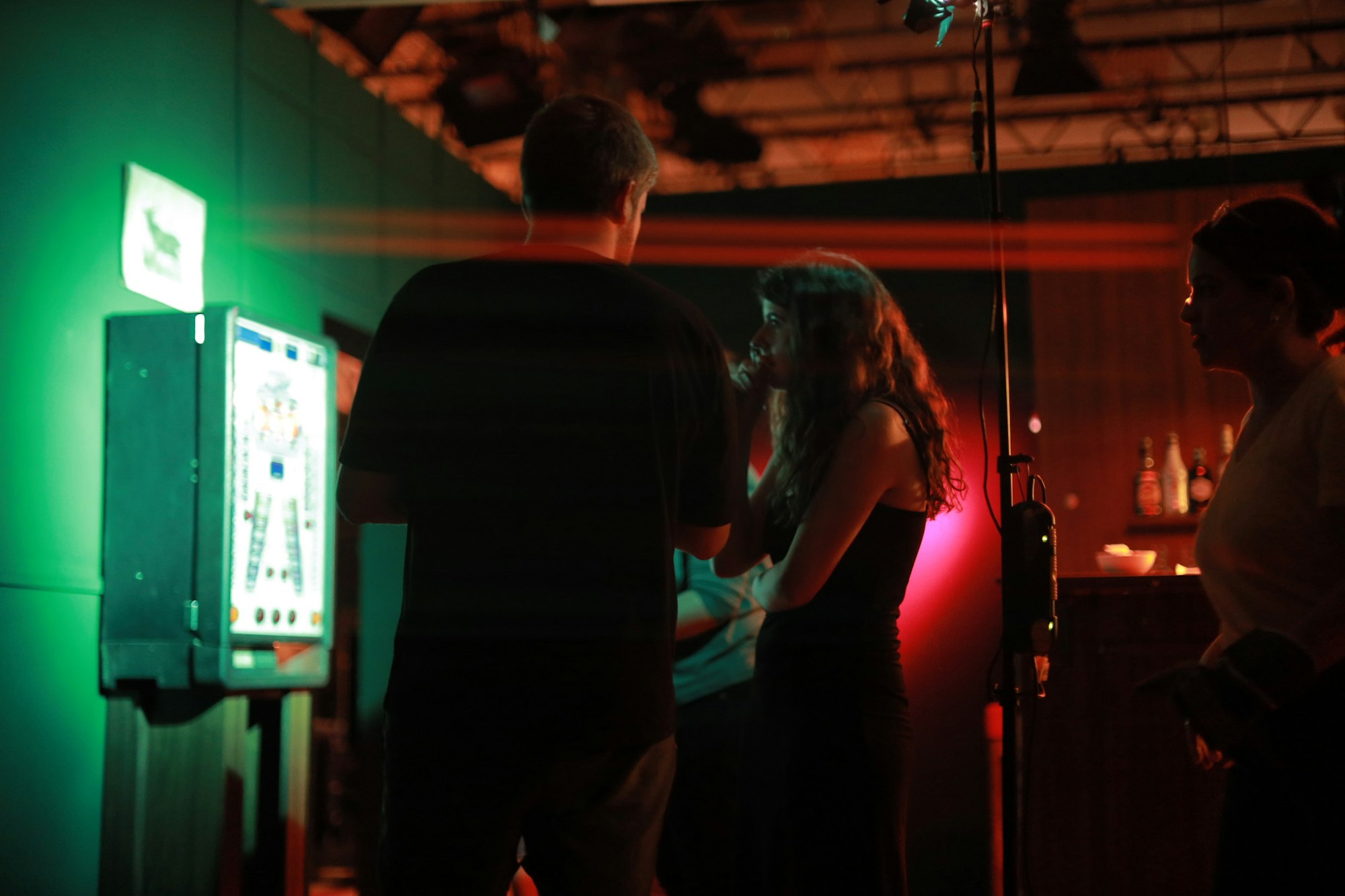 Conference attendees playing an interactive game in front of a large screen. Photo by Rapha Wilde on Unsplash