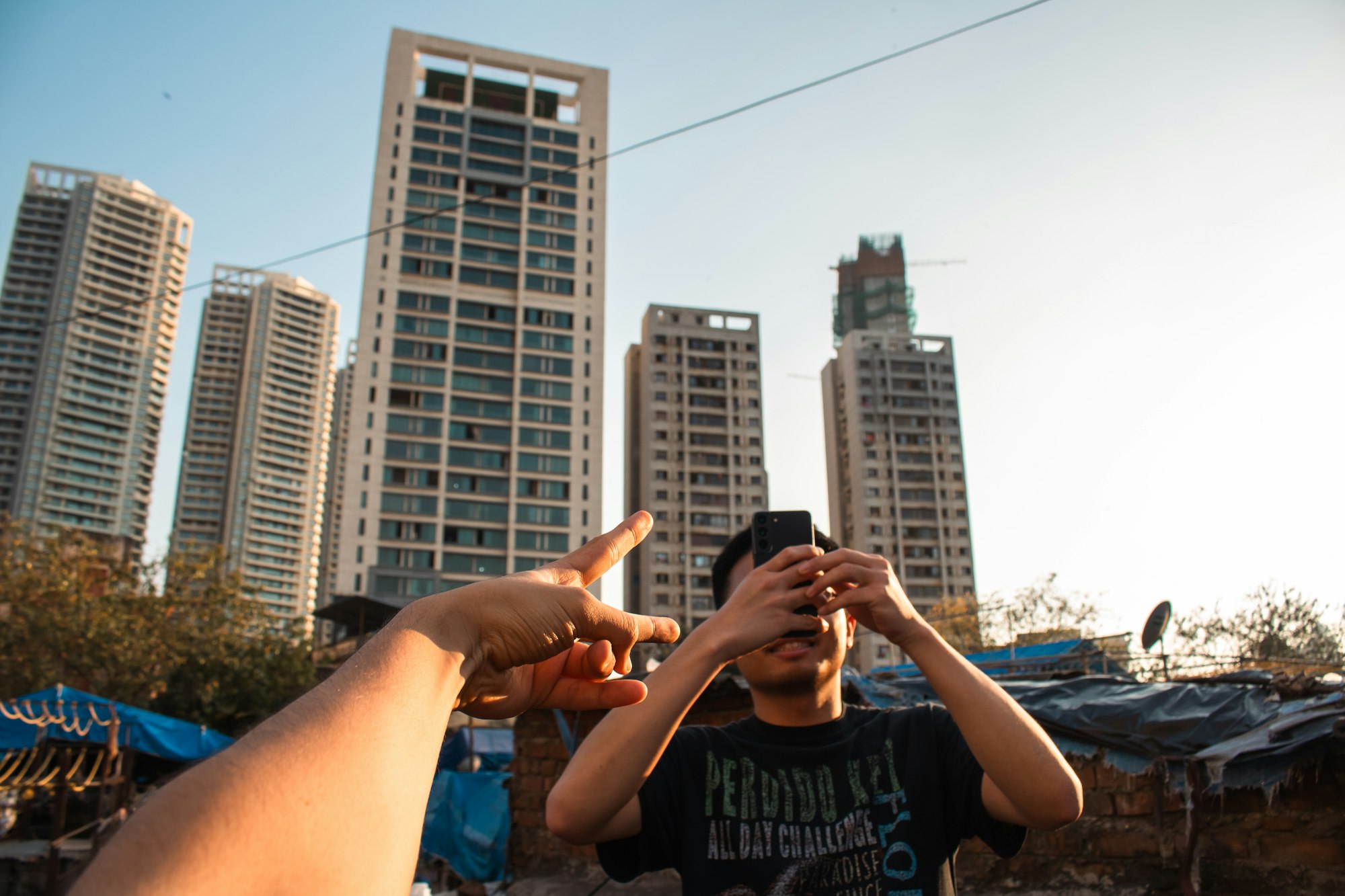 People using smartphones outdoors during a city activity. Photo by Zoshua Colah on Unsplash