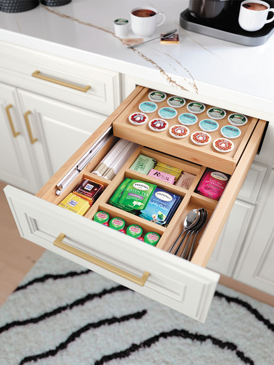 Pull out drawer with kcups of coffee and tea bags.