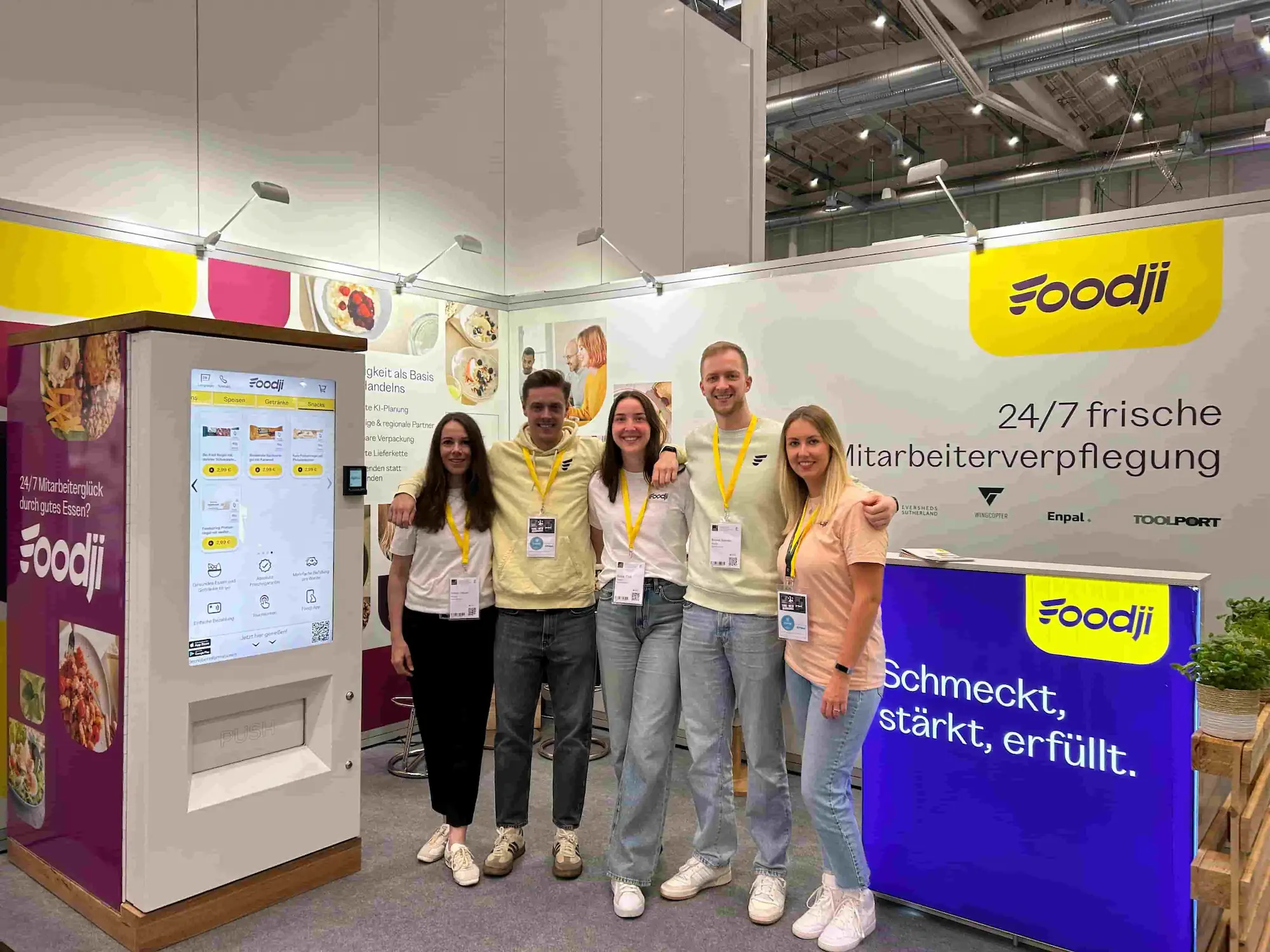 Team stands on exhibition stand