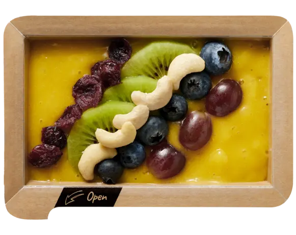 Gelbe Frühstücksbowl mit Früchten