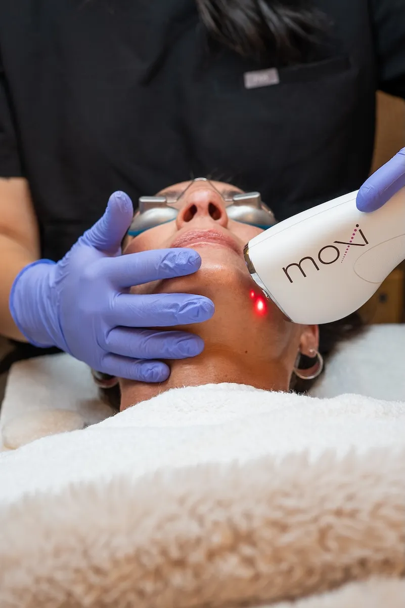 Client receiving a DiamondGlow facial at Allied Medical Aesthetics in Westminster, CO