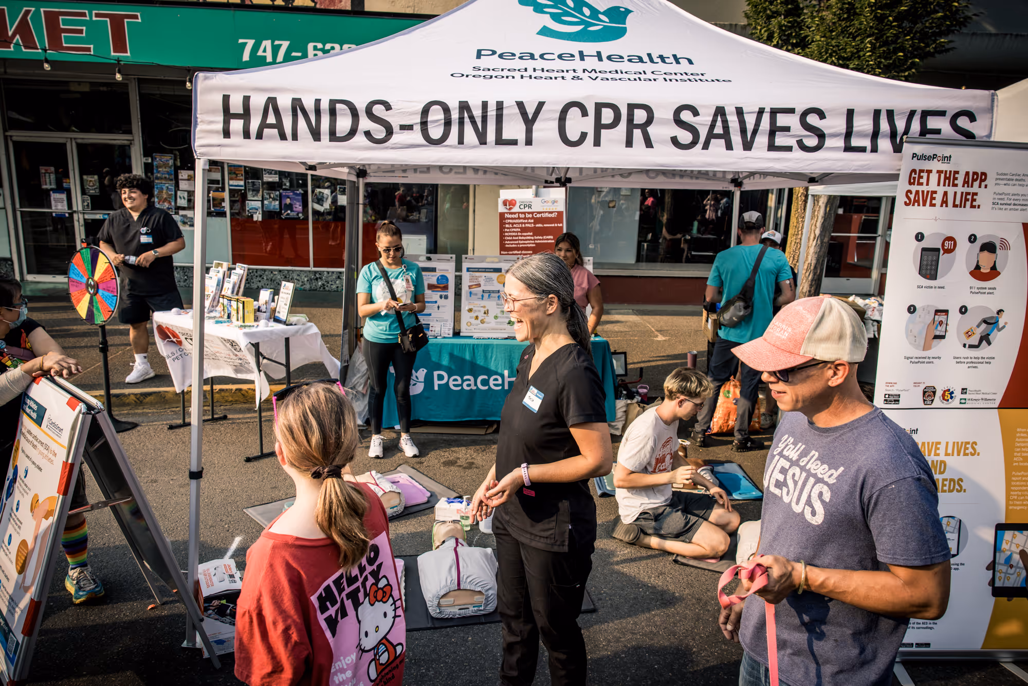 Downtown Springfield at The Block Party 2025 - Oregon CPR from PeaceHealth, Ken Kesey Mural, Main Street, Springfield Oregon