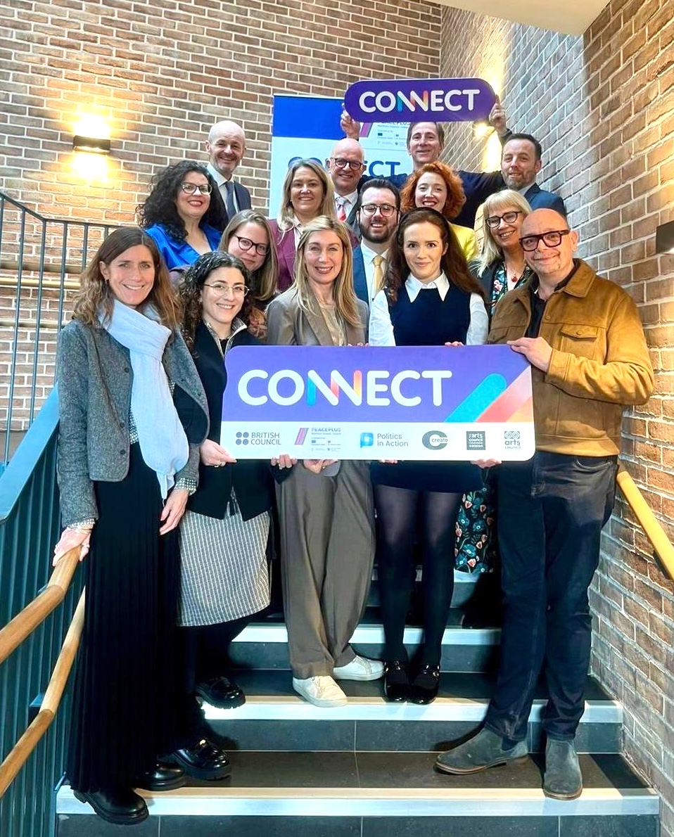 Tony Blair and Bertie Ahern surrounded by school students