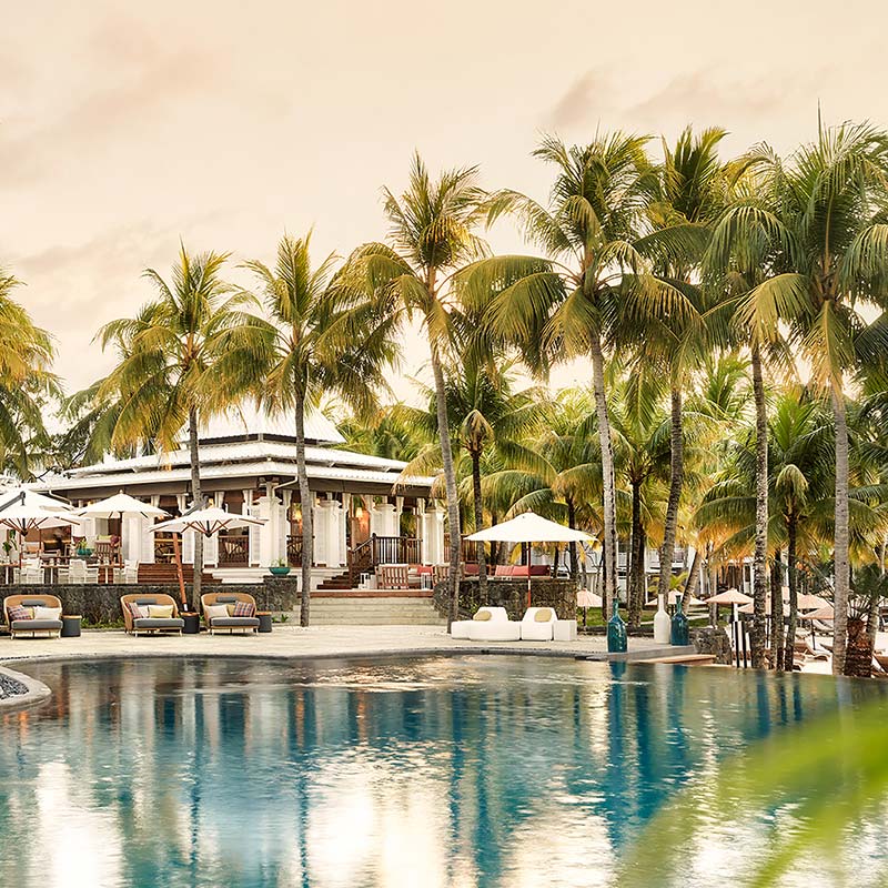 Main pool and restaurant at sunset