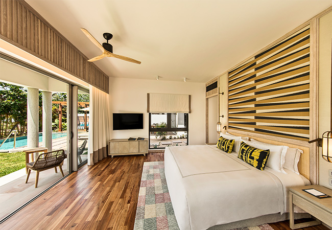 Two Bedroom Pool Villa bedroom overlooking the pool