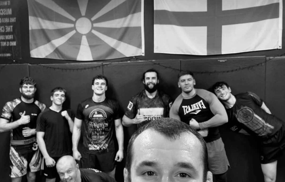 Luke Thorsen Standing in a gym with team mates