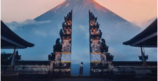 Person doing a star jump at Lempuyang Temple