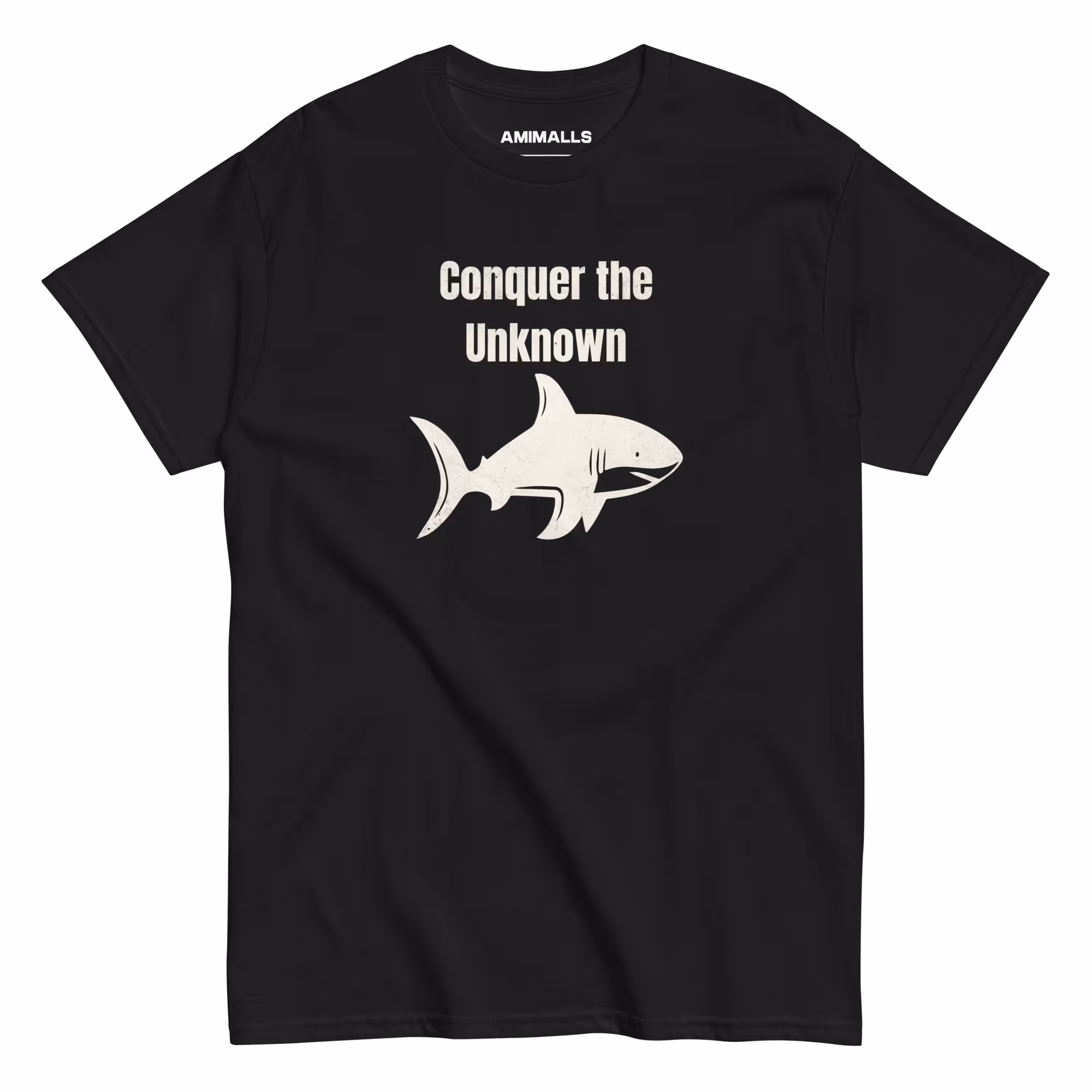 Black T-shirt featuring a shark graphic with "Conquer the Unknown" motivational text.
