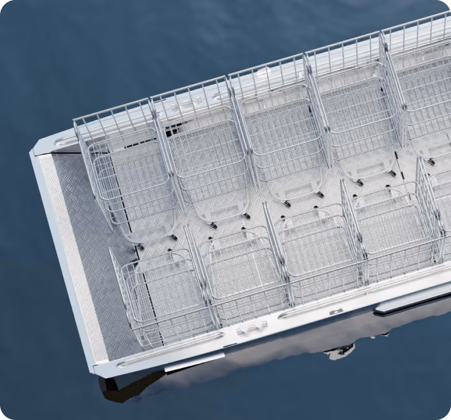 Bird's-eye view of a boat's metal deck with ten empty metal wire baskets arranged in two rows.