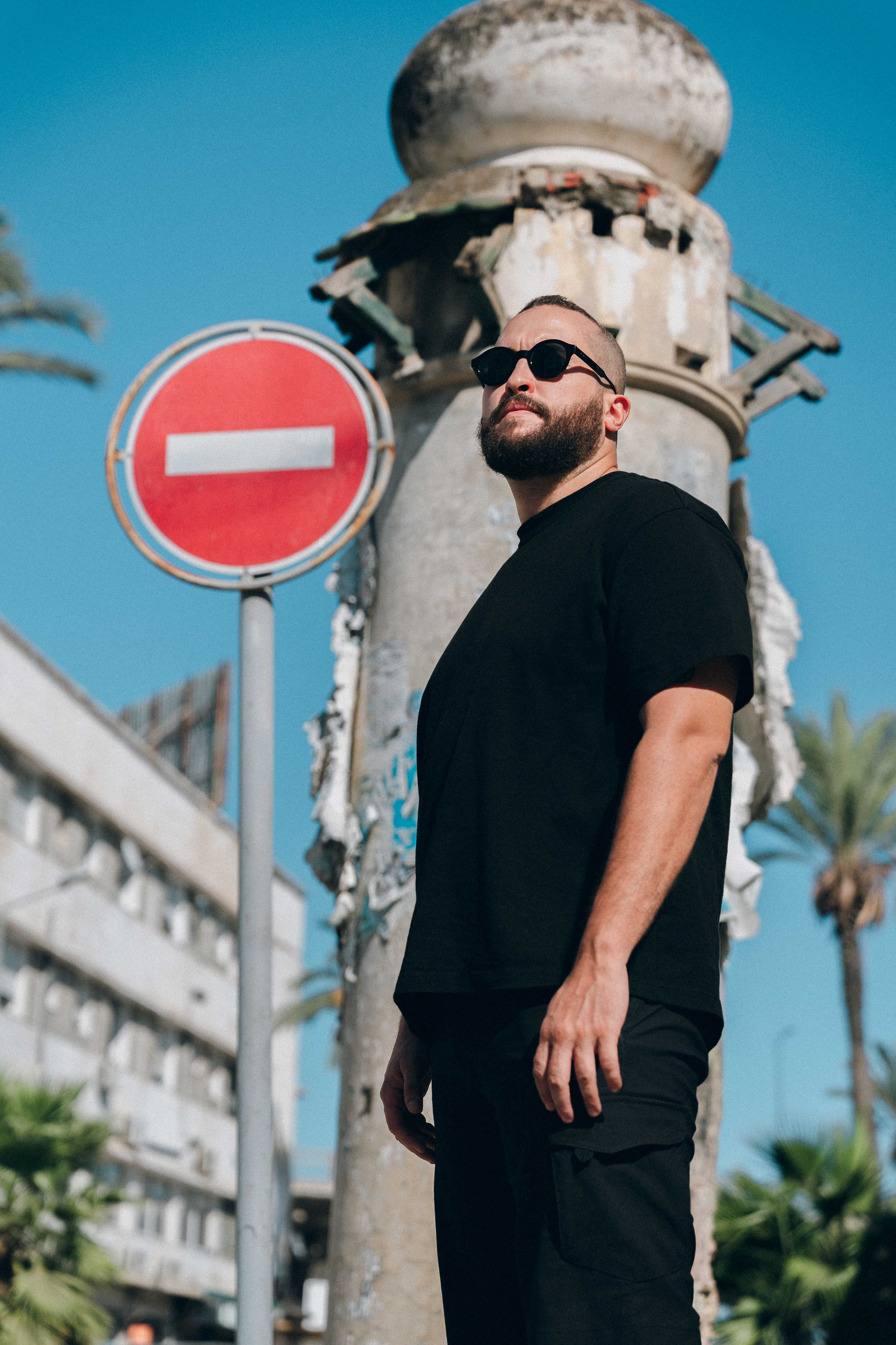 Hamdi Ryder Next To A Stop Sign 