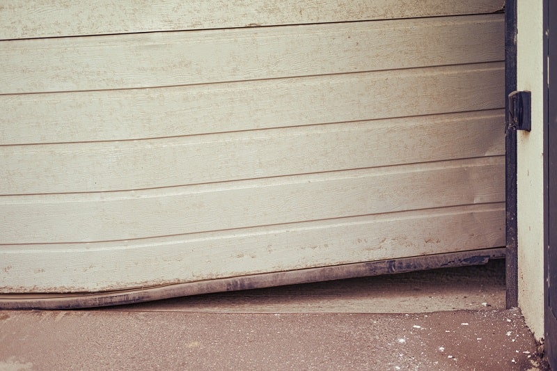A bent garage door that won’t close