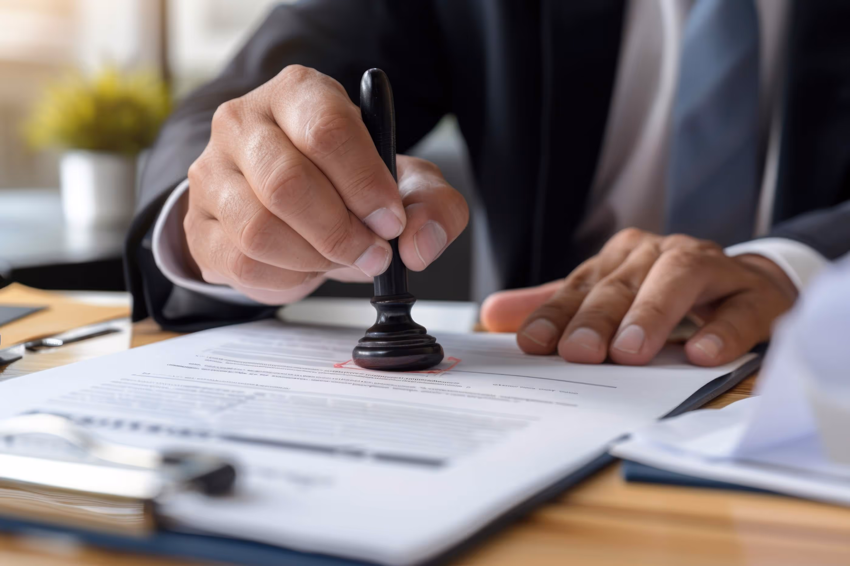 A man stamping an application form