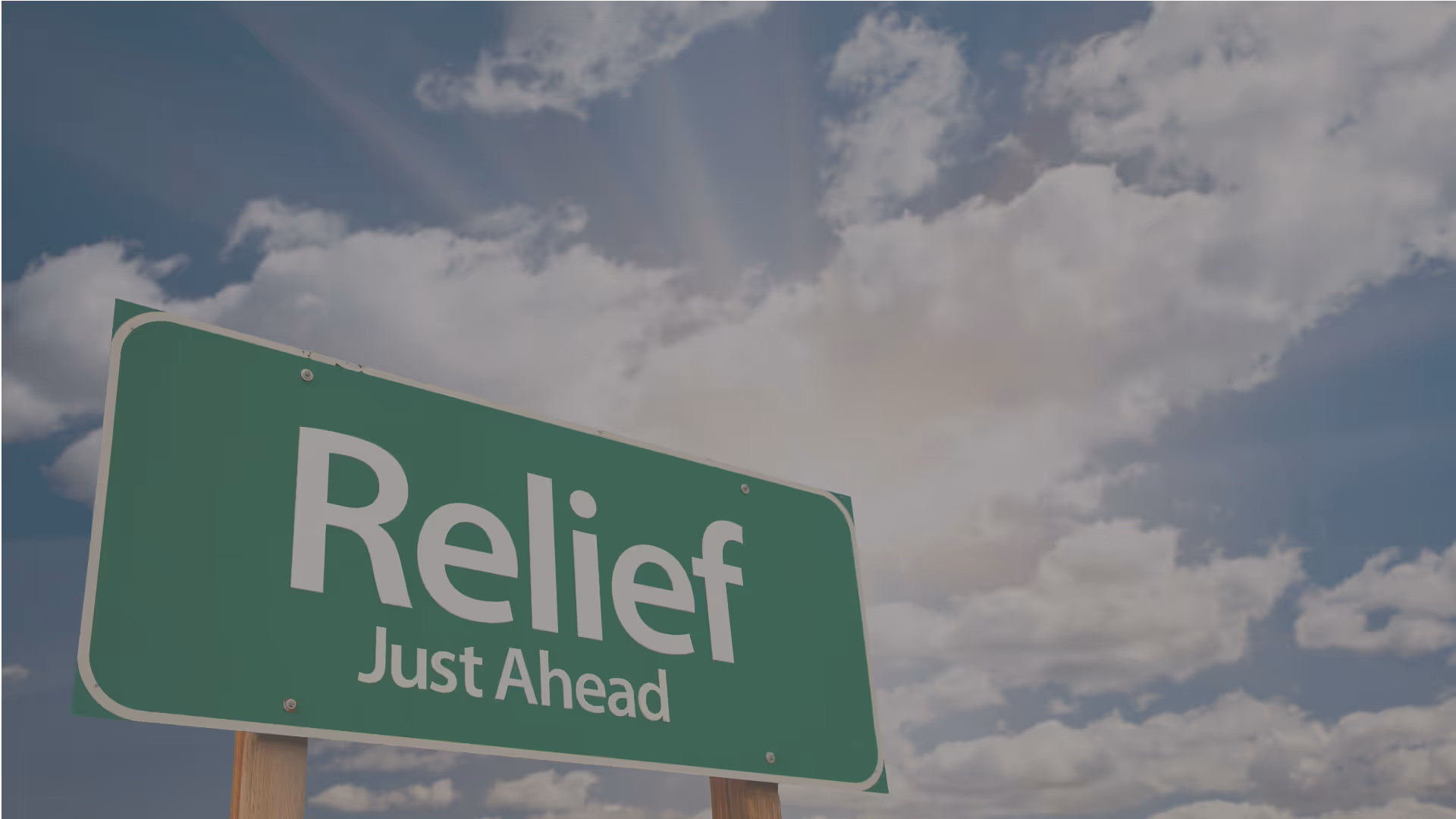 a sign saying "Relief Just Ahead"